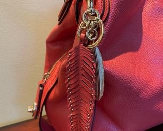 Very nice selection of newer Coach handbags and wallets, like this “Edie” Dark Rouge Shoulder Bag  model with keychain