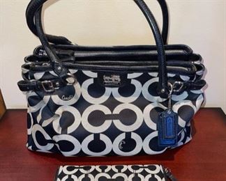 Very nice selection of newer Coach handbags and wallets, including this “Madison” Op Art model