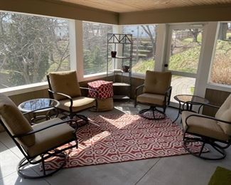 Patio set is being sold as 4 swivel/rocking chairs and two glass-top side tables.  