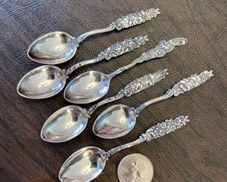 Antique sterling silver demitasse spoons with a floral assortment motif