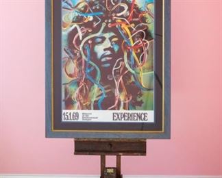 Jimi Hendrix Experience–1969 US Tour Merchandising Poster for 1969 German tour by German artist Gunther Kieser.  Tripod reflection in photo.  Artwork under mat board is larger than what is visible. Visible artwork measures 22 ⅝" x 33".  Frame measures  31 ⅛"  x 41 ⅜".  