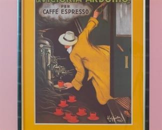 La Victoria Arduino Per Caffe Espresso poster. Numbered #922.  Professionally framed by Sherman Gallery, Venice, California.  Artwork under mat board is larger than what is visible. Visible artwork measures 21 ⅜" x 29".  Frame measures  29 ½"  x 37 ½".   A Leonetto Cappiello poster featuring a man in a yellow coat pouring himself espresso while boarding a train.