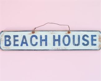 Wooden Beach House artwork with metal hook.