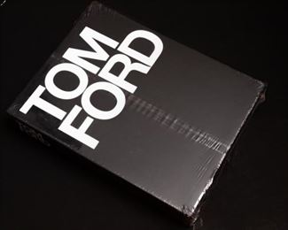 Tom Ford Coffee Table Book (New in Plastic) 
by Graydon Carter, Tom Ford, Anna Wintour (Foreword), Bridget Foley — 
This book is a complete catalogue of Ford's design work for both Gucci and Yves Saint Laurent from 1994 to 2004. It chronicles not only Ford's clothing and accessories designs for both houses, but also explores Ford's grand vision for the complete design of a brand, including architecture, store design, and advertising.

Tom Ford features more than 200 photographs by Richard Avedon, Mario Testino, Steven Meisel, Helmut Newton, Herb Ritts, Terry Richardson, Craig McDean, Todd Eberle, and numerous other photographers including many previously unpublished images.