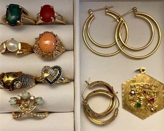 Item 69:  14K & Green Stone Ring (1st row left):  SOLD                Item 70:  14K & Red Carnelian Ring (1st row right):  $165                                                                  
Item 71:  14K & Pearl Ring (2nd row left):  $175                                                                          
Item 72:  14K & Coral Ring (2nd row right):  $265                        
Item 73:  18K Owl & Diamond Ring (3rd row left):  $375                                                                                                     
Item 74:  14K & Diamond Heart Shaped Ring (3rd row right):  $175          
Item 75:  14K Opal & Diamond Ring (5th row):  SOLD                                                                                                                            Item 76:  14K Hoop Earrings (top row right):  SOLD                     
Item 77:  14K Earrings (2nd row left):  $125                                                Item 78:  14K Forget Me Not Char