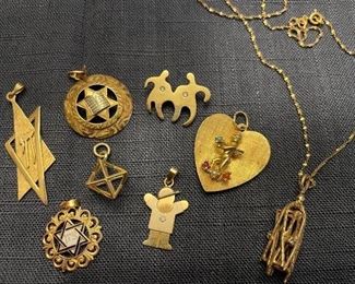 Item 104:  14K Star of David Charm (1st from left top row):  $100               
Item 105:  14K Charm (2nd from left top row):  $100                                            
Item 106:  14K Charm with Two People (3rd from left top row):  $165                                                                                                     
Item 107:  14K Heart (4th from left top row):  $155                         Item 108:  14K Star of David Charm (2nd row left):                                                                         Item 109:  14K Charm (2nd row middle):  $60                                                                       Item 110:  14K "Boy" Charm (2nd row right):  $95                                              