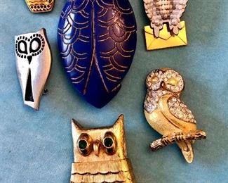 Jewelry Group T                                                                                                Blue owl from France $12.00                                                                       Little Danish pin $12.00                                                                            Carol Lee owl, Rinestones, $20.00                                                                          Avon Owl pin, Large gold finish $10.00