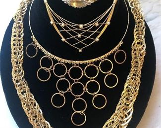 Jewelry #16                                                                                                         Jules Jurgensen gold tone watch, $45.00                                          Gold tone choker style circle necklace $18.00                                  Large rolled gold tone necklace $25.00                                            Pretty diamond shaped wire necklace with pearls $18.00