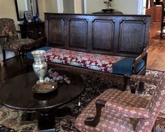 Round coffee table; upholstered chair