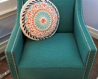 Sharp-looking upholstered chair with nail head trim