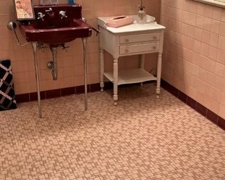 Also check out the pink and burgundy bathroom