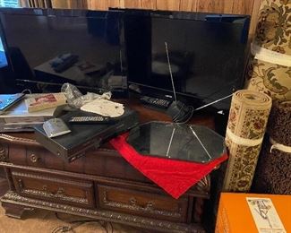 Flatscreen T.V.'s, Coffee Table with Drawers, Room Size Rug, Throw Rugs