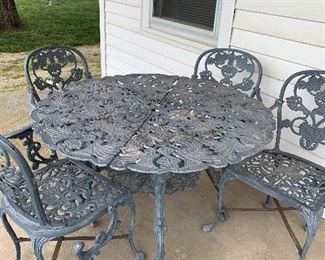 Iron patio table with four chairs