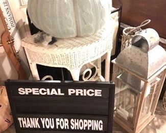 Rattan Nightstand, Marquee Style Sign, Metal Lanterns