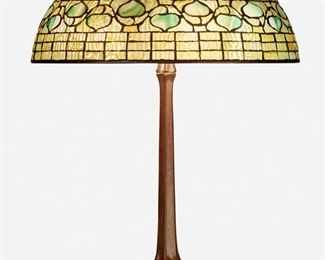 2
A Tiffany Studios "Acorn" Table Lamp
Circa 1901-1903; New York, NY
Shade signed: Tiffany Studios / New York; Base spuriously signed: Tiffany Studios / New York / 533
The green leaded glass "Acorn" shade on a three-light patinated bronze Tiffany-style reproduction base raised on four feet, electrified
Overall: 21.5" H x 16" Dia.
Estimate: $3,000 - $5,000