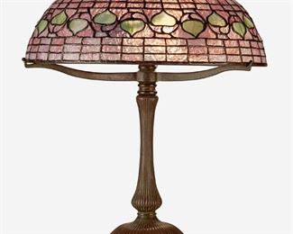 1
A Tiffany Studios "Acorn" Table Lamp
Circa 1902-1919; New York, NY
Base spuriously signed: Tiffany Studios / New York / 28622
The pink and green leaded glass "Acorn" shade on a three-light patinated bronze Tiffany-style reproduction mushroom base with flared column raised on five ball feet, electrified
Overall: 21.5" H x 16" Dia.
Estimate: $4,000 - $6,000