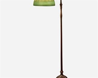 9
A Tiffany Studios Counter-Balance Floor Lamp
Circa 1902-1919; New York, NY
Shade signed: L.C. Tiffany / Favrile; Base singed: Tiffany Studios / New York / 468
The green and gold iridescent damascene Favrile glass shade on a single-light patinated bronze counter-balance base with plain narrow stem, weighted ball in a foliate cradle, and adjustable head raised on five curved legs with spade feet, electrified
Overall: 56" H x 16" Dia.; Shade: 10" Dia.
Estimate: $4,000 - $6,000
