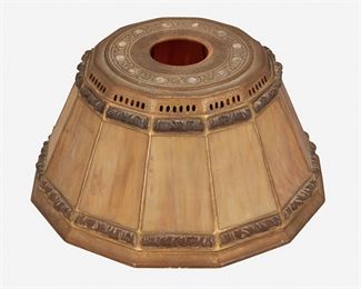 12
A Tiffany Studios "Abalone" Lamp Shade
Circa 1902-1919; New York, NY
Signed: Tiffany Studios / NY / 1928
The gilt-bronze "Abalone" lamp shade with caramel-colored slag glass panels, "linenfold" glass borders, and an interlace motif band to the top with inlaid abalone discs
5" H x 10" Dia.
Estimate: $2,500 - $3,500