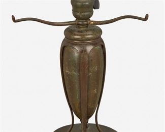 13
A Tiffany Studios "Greek" Table Lamp Base
Circa 1902-1919; New York, NY
Signed: Tiffany Studios / New York / 441
The single-light patinated bronze narrow urn-form "Greek" table lamp base with three arms and four flared feet raised overall on a circular foundation with beaded border, electrified
13" H x 10.75" Dia.
Estimate: $800 - $1,200