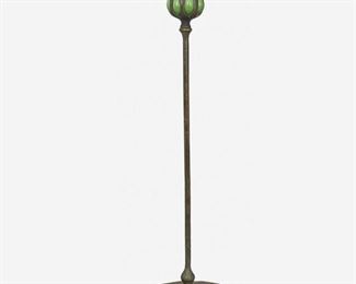 16
A L.C. Tiffany Bronze And Blown Glass Candlestick
Circa 1900-1902; New York, NY
Signed: Tiffany Studios / New York / [T.G.D.Co. monogram] / 25956
The candlestick with a green blown Favrile glass capital with removable bobeche raised on a patinated bronze puddle-style "Plain" base with slender stem
17.5" H x 5.75" Dia.
Estimate: $2,000 - $3,000