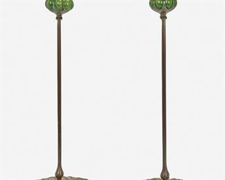17
A Pair Of Tiffany-Style Candlesticks
20th Century
Each spuriously signed
Each with green blown glass capitals and removable bobeches raised on a verdigris patinated bronze base with Queen Anne's lace motif and slender stem, 2 pieces
Each: 17.75" H x 7.5" Dia.
Estimate: $1,000 - $1,500
