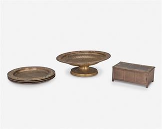 24
Five Louis C. Tiffany Furnaces Gilt-Bronze Table Items
Circa 1919-1928; New York, NY
Each signed: Louis C. Tiffany Furnaces, Inc. / [L.C.T. monogram] / Favrile; Further marked: 131 / 325 / 523
Each gilt-bronze with quatrefoil and cartouche motif border and enamel details, comprising one compote with a red and yellow enamel border, three chargers with blue and green enamel borders and each raised on five flattened ball feet, and one cedar lined lidded rectangular cigarette box with a green enamel border to the lid, 5 pieces
Largest: 3.375" H x 9.875" Dia.; Smallest: 2.5" H x 6.25" W x 3.875" D
Estimate: $400 - $600