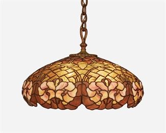 49
A Duffner And Kimberly Leaded Glass Chandelier
First-quarter 20th Century; New York, NY
Unsigned
The leaded glass domed shade with pink and amber floral motif and free-form edge fitted with a six-light socket cluster, patinated bronze heat cap and suspended chain link harness, and acorn pulls, electrified
16" H x 24" Dia.
Estimate: $2,000 - $3,000