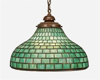 51
A Green Leaded Glass Chandelier
First-quarter 20th Century
The three-light, bell-form green leaded glass chandelier with geometric pattern and lace-style metal trim fitted with patinated metal cap, suspended chain link harness, and canopy, electrified
16" H x 21" Dia.
Estimate: $700 - $900