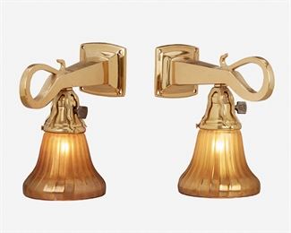 53
A Pair Of Arts And Crafts Polished Brass And Glass Sconces
First-quarter 20th Century
Each polished brass sconce with a crook-form stem issuing a floriform socket fitted with a flared and ribbed gold iridescent art glass shade, electrified, 2 pieces
Each: 8.75" H x 5" W x 9.5" D
Estimate: $600 - $800