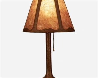55
An Arts And Crafts Hammered Copper Boudoir Lamp
First-quarter 20th Century
Appears unsigned
Possibly by Fred Brosi "Ye Olde Copper Shoppe," the Arts and Crafts boudoir lamp with a conical hammered copper shade with six mica panels on a single-light weighted hammered copper base with a reeded foot and three arms, electrified
Overall: 18" H x 10" Dia.
Estimate: $500 - $700