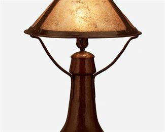 56
A Dirk Van Erp Hammered Copper Table Lamp
Circa 1913-1915; San Francisco, California
Signed: Dirk van Erp [open-box mark]
The Arts and Crafts table lamp with a conical hammered copper shade with three mica panels on a single-light hammered copper base with a flared body and three arms, electrified
Overall: 21" H x 14.5" Dia.
Estimate: $1,000 - $1,500