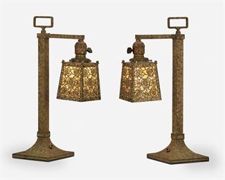 57
A Pair Of Bradley & Hubbard Arts And Crafts Desk Lamps
First-quarter 20th Century; Meriden, Connecticut
Each signed: B&H
Each verdigris patinated metal with a squared column issuing an arm terminating in a square shade with yellow and white slag glass panels and pine cone metal overlay, electrified, 2 pieces
Each: 17.75" H x 5.625" W x 10.5" D
Estimate: $600 - $800