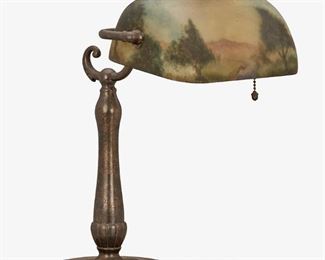 88
A Handel Reverse-Painted Glass Landscape Piano Lamp
First-quarter 20th Century; Meriden, Connecticut
Base signed: Handel [cloth label]
The pivoting cylindrical glass shade with reverse-painted wooded landscape with a stream on a single-light bronzed metal base with scrolled detail and tapered stem with gadrooned motif atop a circular foot with egg and dart border, electrified
14.5" H x 10" W x 13" D
Estimate: $700 - $900