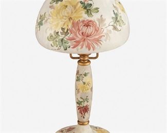 91
A Handel Painted Glass "Chrysanthemum" Boudoir Lamp
First-quarter 20th Century; Meriden, Connecticut
Shade signed: Handel / 7065; Base signed: Handel
The domical opaque white glass shade with obverse-painted yellow and mauve chrysanthemums on a matching single-light glass base with chipped ice finished tapered column fitted with bronzed metal hardware and raised on five ball feet, electrified
Overall: 13.25" H x 7" Dia.
Estimate: $600 - $800