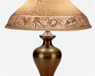 93
A Pairpoint Reverse-Painted Glass "Carlisle" Table Lamp
1907-1929; New Bedford, Massachusetts
Shade signed: The Pairpoint Corp.; Base signed: Pairpoint / ["P" diamond monogram] / C 3045 / Made in U.S.A.
The conical chipped ice finished glass "Carlisle" shade with reverse-painted floral band with peacocks against a yellow ground with leaf and vine motif on a two-light baluster-form brass base, electrified
Overall: 22.5" H x 18" Dia.
Estimate: $800 - $1,200
