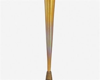101
A Griffoul Patinated Bronze And Art Glass Trumpet Vase
1916
Bronze signed: Griffoul / Copyright 1916 / Genuine Bronze
The gold iridescent art glass trumpet vase, likely by Quezal, with ruffled lip on a Griffoul patinated bronze base depicting swallows in flight
14" H x 3.75" Dia.
Estimate: $400 - $600