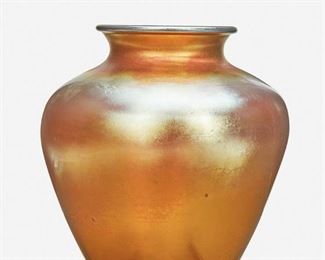 102
A Gold Steuben Aurene Glass Vase
Circa 1904-1933; Corning, New York
Signed: Aurene / 2683
The gold Aurene glass vase, model no. 2683, shaded pink with wide-shouldered body and flared neck
10.75" H x 9.5" Dia.
Estimate: $400 - $600
