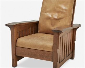 111
An L. & J.G. Stickley Oak Morris Chair, No. 410
1906-1912; Fayetteville, NY
Label: L. & J.G. Stickley Handcraft
The oak ladder back Morris chair with adjustable back, corbeled drop arms, and original tan leather seat and back cushion raised on four square legs with through-tenon construction and slatted sides
40" H x 32.25" W x 38" D
Estimate: $4,000 - $6,000