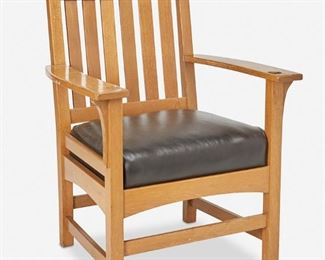 112
An L. & J.G. Stickley Oak Armchair, No. 422
Circa 1912-1917; Fayetteville, NY
Paper label: The Work of L. & J.G. Stickley
The oak slat back chair with six slats and corbeled arms over a black leather seat atop an arched seat rail and four square legs joined by a box stretcher
38" H x 27.75" W x 24" D
Estimate: $300 - $400