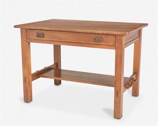 113
An L. & J.G. Stickley Oak Library Table, No. 529
Circa 1912-1917; Fayetteville, NY
Paper label: The Work of L. & J.G. Stickley
The original finish oak library table with splined top over a single drawer with two hand-hammered copper drop bail handles atop a keyed mortise and tenon lower shelf raised on four square legs joined by two stretchers
29" H x 42" W x 28" D
Estimate: $800 - $1,200