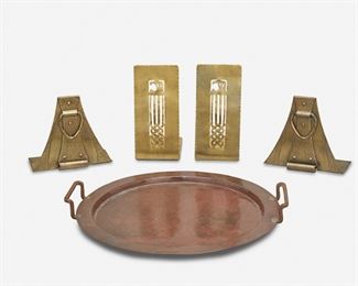 123
A Group Of American Arts And Crafts Metal Accessories
First-quarter 20th Century
First marked: Handwrought by F. Novick / Chicago; Second marked: Forest Craft Guild; Third marked: [Roycroft orb and cross middle mark]
Comprising a Falick Novick hand-wrought copper tray with hammered surface and two raised handles, a pair of Forest Craft Guild brass bookends with openwork design, and a pair of Roycroft copper bookends with studded strap motif and drop handles, 5 pieces
Largest: 1.5" H x 12.75" Dia.; Smallest: 5.125" H x 5.5" W x 2.5" D
Estimate: $300 - $500