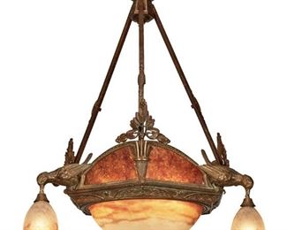 133
A Muller Frères Glass And Wrought Iron Chandelier
Second-quarter 20th Century; Luneville, France
Signed: Muller Freres Luneville
The six-light chandelier with upper gallery of mica panels atop a mottled white, pink, and purple frosted glass bowl enclosed in a wrought iron frame with foliate motifs, fish scale border, and three natralistic doves issuing drop pendant lights with matching glass shades and fitted with an openwork canopy and three square hanging shafts, electrified
35" H x 24" Dia.
Estimate: $800 - $1,200