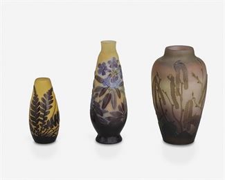 137
Three Gallé Cameo Glass Vases
Late 19th/early 20th Century; Nancy, France
Each signed: Galle
Each acid-etched cameo glass, comprising one "Hazel Catkins" urn-form vase cut from amber to light pink and green frost, one tapered "Oleander" vase with a cylindrical neck cut from purple and blue to yellow frost, and one tapered "Fern" vase cut from red to yellow frost, 3 pieces
Largest: 6" H x 3.5" Dia.; Smallest: 4" H x 1.875" Dia.
Estimate: $600 - $800