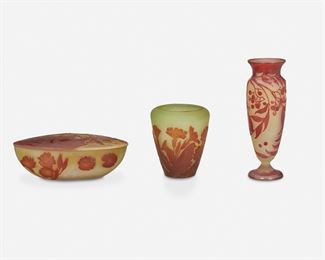 138
Three Gallé-Style Cameo Glass Items
First-quarter 20th Century
Each spuriously signed for Galle
Each acid-etched cameo glass, comprising one baluster-form vase with berry motif cut from red to yellow frost, one urn-form "Primrose" vase cut from orange to light yellow frost, and one oval "Primrose" covered bowl cut from orange to light yellow frost, 3 pieces
Largest: 8" H x 2.75" Dia.; Smallest: 2.75" H x 8" W x 3.5" D
Estimate: $700 - $900