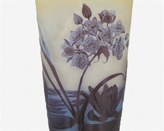 142
A Gallé Cameo Glass "Pond Lily" Vase
Late 19th/early 20th Century; Nancy, France
Signed: Galle
The acid-etched cameo glass trefoil-form "Pond Lily" vase with tapering body cut from purple and blue to clear and yellow frost
8.25" H X 5.25" Dia.
Estimate: $500 - $700