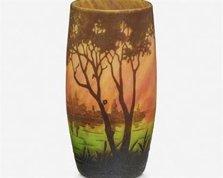 145
A Daum Cameo Glass "Paysage Du Lac" Vase
First-quarter 20th Century; Nancy, France
Signed: Daum Nancy [Croix of Lorraine]
The acid-etched cameo glass vase cut from brown to mottled pink and green frost with wooded lakeside motif
4.75" H x 2.5" Dia.
Estimate: $300 - $500