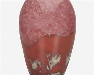 158
A French Art Glass Vase
Second-quarter 20th Century
Signed indistinctly to side and bottom
The urn-form art glass vase with a mottled pink body and a red and white mottled wave-form motif
11" H x 6.5" Dia.
Estimate: $400 - $600