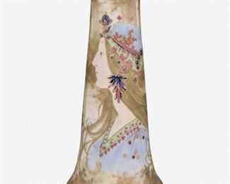 162
An Amphora Art Pottery Portrait Vase
Late 19th/early 20th Century
Signed: Amphora / Riessner, Stellmacher & Kessel [RStK] Turn-Teplitz Bohemia / Made in Austria / G 34
The art pottery vase with wide foot, flared rim, and tapered body depicting a profile portrait of a woman in blue and green costume with gilt enamel details
10.5" H x 4.625" Dia.
Estimate: $400 - $600