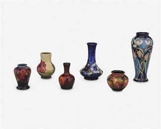 186
Six Moorcroft Pottery Cabinet Vases
Circa 1928-2004; Stoke-on-Trent, England
Each marked for Moorcroft; Each further marked
Comprising one cobalt blue baluster-form vase with white and peach floral motif, one cobalt blue tall-necked vase with wide flared base and blue and purple pansy motif, one yellow bulbous vase with cylindrical neck and red hibiscus motif, one red bulbous vase with tall flared neck and berry motif, one blue urn-form vase with pomegrante motif, and one red globular vase with berry motif, 6 pieces
Largest: 8" H x 3.625" Dia.; Smallest: 2.625" H x 3.125" Dia.
Estimate: $600 - $900186
Six Moorcroft Pottery Cabinet Vases
Circa 1928-2004; Stoke-on-Trent, England
Each marked for Moorcroft; Each further marked
Comprising one cobalt blue baluster-form vase with white and peach floral motif, one cobalt blue tall-necked vase with wide flared base and blue and purple pansy motif, one yellow bulbous vase with cylindrical neck and red hibiscus motif, one red bulbous vase wit