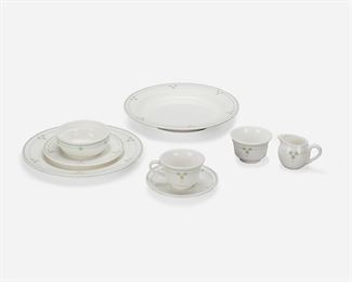 190
A Syracuse China Arts And Crafts-Style "Tudor Rose" China Service
Late 20th/early 21st Century
Each marked: Tudor Rose / Reproduced Especially for Dalton's Antiques by Syracuse China
Each white china with light green stylized Tudor rose pattern and banding, based on a design from 1912-1919, comprising 5 large rim bowls (11.5), 6 dinner plates (11"), 10 dessert plates (7.25"), 10 cereal bowls (4.875"), 10 saucers (6.375"), 10 footed teacups (2.5"), 1 sugar bowl (2.5"), and 1 individual creamer (2.5"), 53 pieces
Estimate: $600 - $900